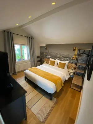 Un ou plusieurs lits dans un hébergement de l'établissement Appartement proche PARIS