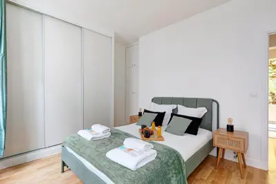 Un ou plusieurs lits dans un hébergement de l'établissement Le Bellanger - Duplex tout équipé proche Paris