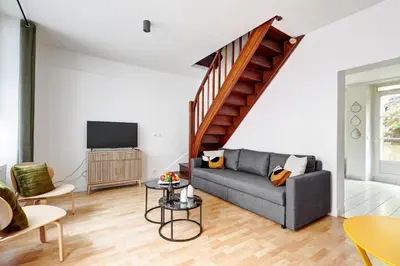 Coin salon dans l'établissement Le Bellanger - Duplex tout équipé proche Paris