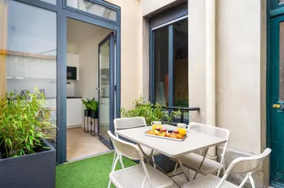 Coin salon dans l'établissement Le Jean Jaurès - Studio cosy au cœur de Boulogne