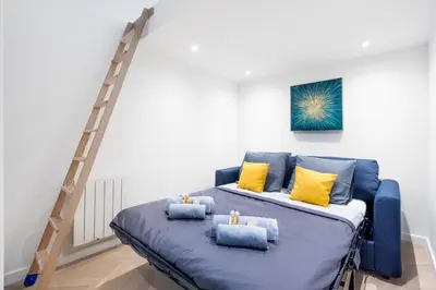 Un ou plusieurs lits dans un hébergement de l'établissement Le Jean Jaurès - Studio cosy au cœur de Boulogne