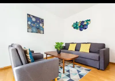 Coin salon dans l'établissement Le Raspail - Charmant appartement proche Paris