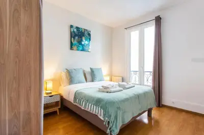 Un ou plusieurs lits dans un hébergement de l'établissement Le Raspail - Charmant appartement proche Paris