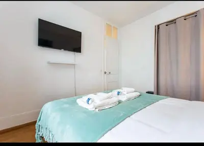 Un ou plusieurs lits dans un hébergement de l'établissement Le Raspail - Charmant appartement proche Paris