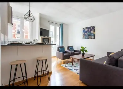 Coin salon dans l'établissement Le Raspail - Charmant appartement proche Paris