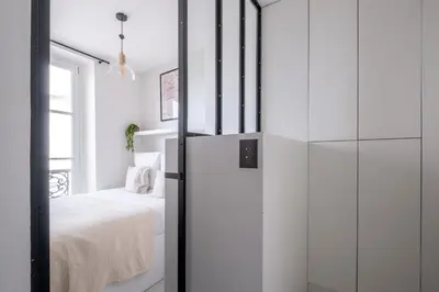 Un ou plusieurs lits dans un hébergement de l'établissement Havre de Luxe au Pied de Montmartre