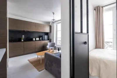 Un ou plusieurs lits dans un hébergement de l'établissement Havre de Luxe au Pied de Montmartre