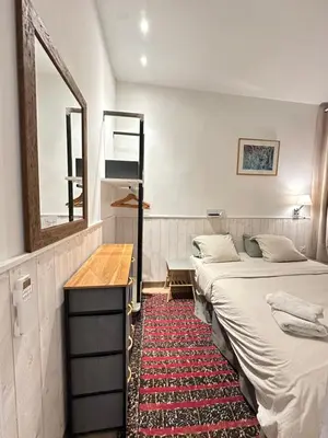 Un ou plusieurs lits dans un hébergement de l'établissement Charles V Marais Apartment