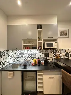 Cuisine ou kitchenette dans l'établissement Charles V Marais Apartment