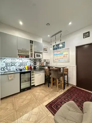 Cuisine ou kitchenette dans l'établissement Charles V Marais Apartment