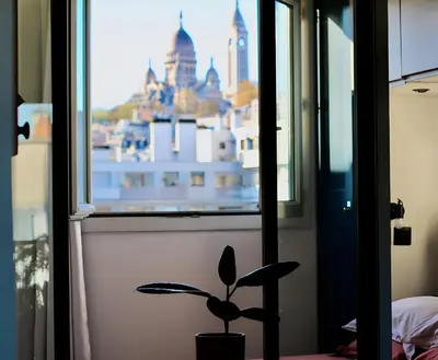 Un ou plusieurs lits dans un hébergement de l'établissement Superbe Loft avec Vue Incroyable sur Montmartre