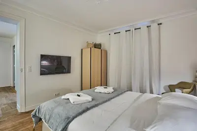 Un ou plusieurs lits dans un hébergement de l'établissement Apartment Eiffel Tower Trocadero by Studio Prestige
