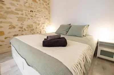Un ou plusieurs lits dans un hébergement de l'établissement Appartement Moderne Notre-Dame de Paris