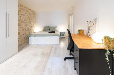 Un ou plusieurs lits dans un hébergement de l'établissement Appartement Moderne Notre-Dame de Paris