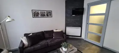 Coin salon dans l'établissement L'Urban Clignancourt - Bel appartement tout équipé aux Portes de Paris