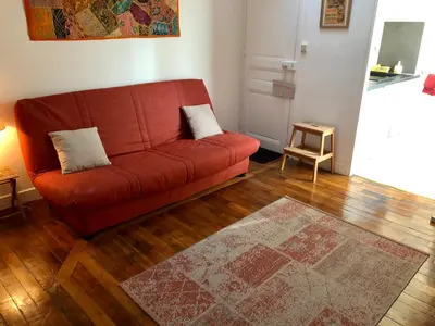 Coin salon dans l'établissement Appartement calme Paris XXeme