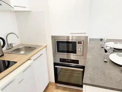 Cuisine ou kitchenette dans l'établissement Nice apt nearby arc triomphe champe elysee