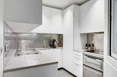 Cuisine ou kitchenette dans l'établissement Lumineux Place du Commerce