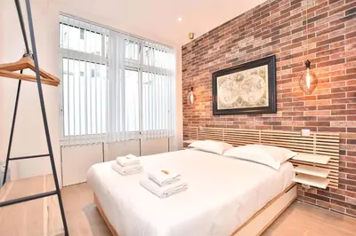 Un ou plusieurs lits dans un hébergement de l'établissement Charmant appartement Paris