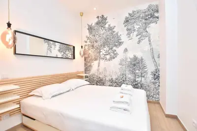 Un ou plusieurs lits dans un hébergement de l'établissement Charmant appartement Paris