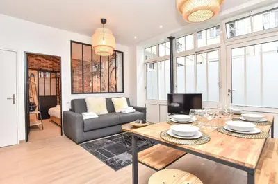 Coin salon dans l'établissement Charmant appartement Paris