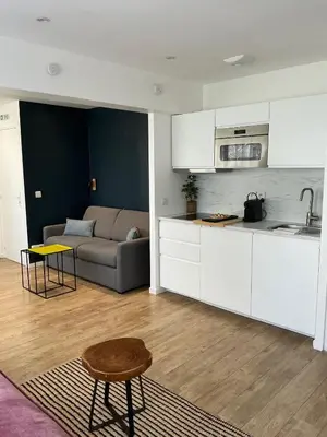 Cuisine ou kitchenette dans l'établissement Appartement Sacré Cœur - Cottages 1