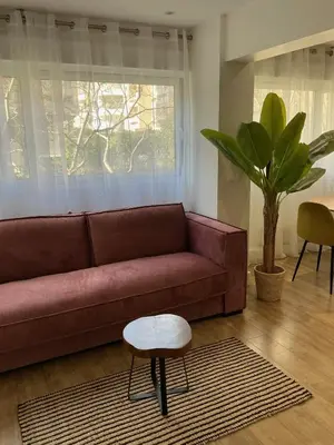Coin salon dans l'établissement Appartement Sacré Cœur - Cottages 1