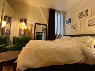Un ou plusieurs lits dans un hébergement de l'établissement Appartement Paris 10e Arrondissement