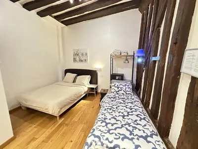 Un ou plusieurs lits dans un hébergement de l'établissement St Paul Marais Flat Ground Floor