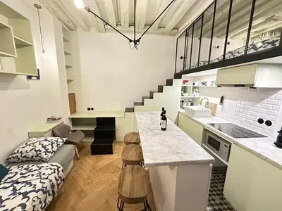 Cuisine ou kitchenette dans l'établissement Cosy Flat In Marais