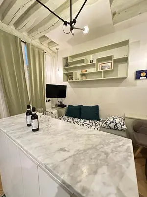 Télévision ou salle de divertissement dans l'établissement Cosy Flat In Marais