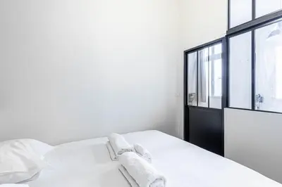 Un ou plusieurs lits dans un hébergement de l'établissement GuestReady - Comfortable retreat in the 11th Arr