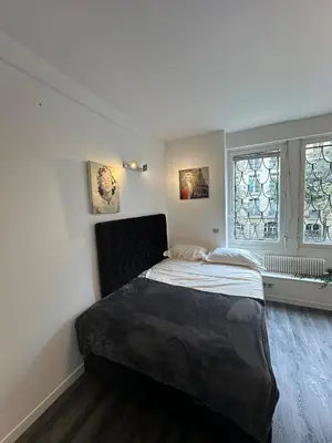 Un ou plusieurs lits dans un hébergement de l'établissement Beautiful Studio Paris Eiffel Tower