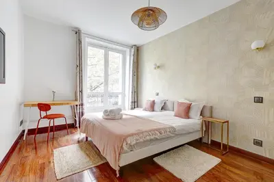 Un ou plusieurs lits dans un hébergement de l'établissement Martine Suite, Place de la République