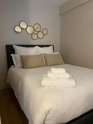 Un ou plusieurs lits dans un hébergement de l'établissement Appartement Swan House Paris Champs Elysée