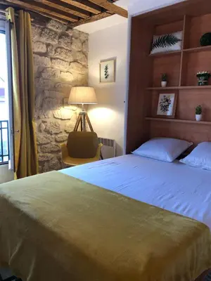 Un ou plusieurs lits dans un hébergement de l'établissement Coup de cœur à Montorgueil