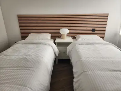 Un ou plusieurs lits dans un hébergement de l'établissement FAMILY APARTMENT's LUXURY 8 guests
