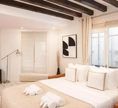 Un ou plusieurs lits dans un hébergement de l'établissement Le Marais - Premium family apartment for 6