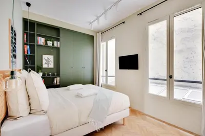 Un ou plusieurs lits dans un hébergement de l'établissement Wonderful Apartment - Bastille