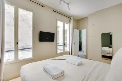 Un ou plusieurs lits dans un hébergement de l'établissement Wonderful Apartment - Bastille