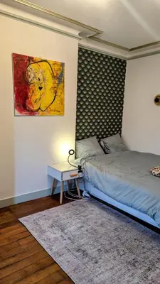 Un ou plusieurs lits dans un hébergement de l'établissement Lovely flat in Paris
