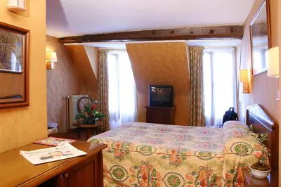 Un ou plusieurs lits dans un hébergement de l'établissement Hotel Meslay Republique