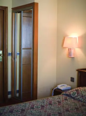 Un ou plusieurs lits dans un hébergement de l'établissement Hotel Meslay Republique