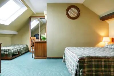 Un ou plusieurs lits dans un hébergement de l'établissement Hotel Meslay Republique