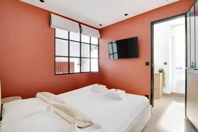 Un ou plusieurs lits dans un hébergement de l'établissement REPUBLIQUE - Cozy Appartement L001