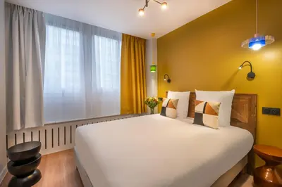 Un ou plusieurs lits dans un hébergement de l'établissement West Paris Suite
