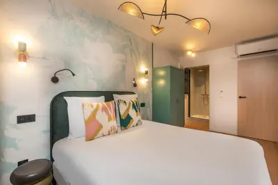 Un ou plusieurs lits dans un hébergement de l'établissement West Paris Suite