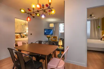 Un ou plusieurs lits dans un hébergement de l'établissement West Paris Suite
