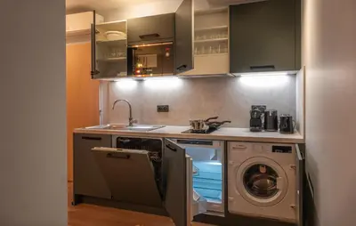 Cuisine ou kitchenette dans l'établissement West Paris Suite