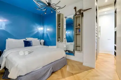 Un ou plusieurs lits dans un hébergement de l'établissement Beautiful loft 130m2 Louvre Palais Royal - II